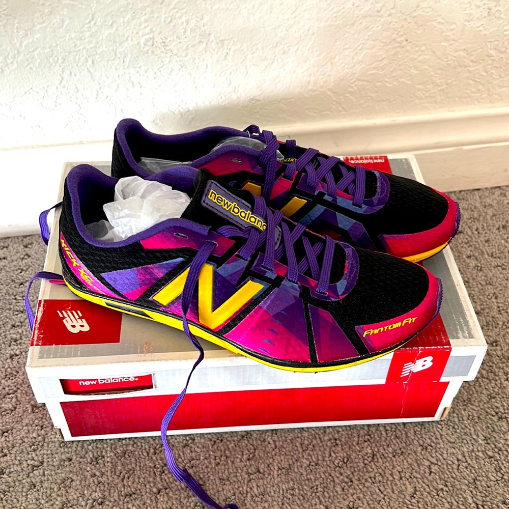 New Balance track/XC spikes, never worn, men’s size 4 1/2, for boy or girl.